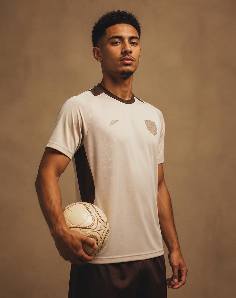 Professional football player holding a ball